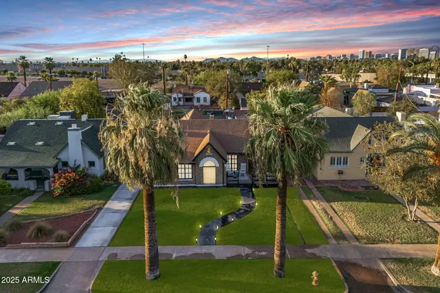 a view of a house with a yard porch and sitting area