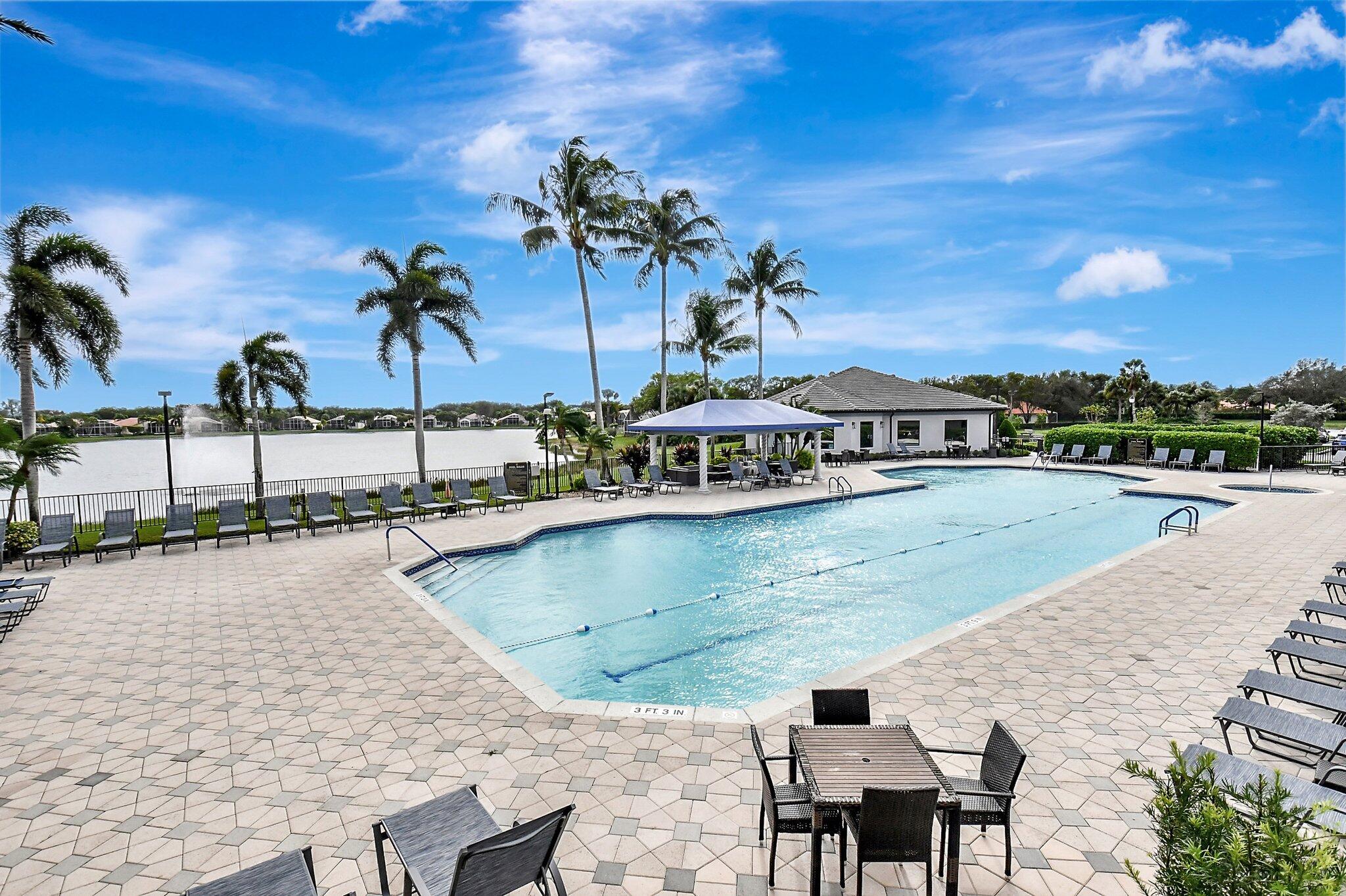8239 Marsala Way Boynton Beach, FL 33472 - Photo 60 of 68 a view of a swimming pool with outdoor seating