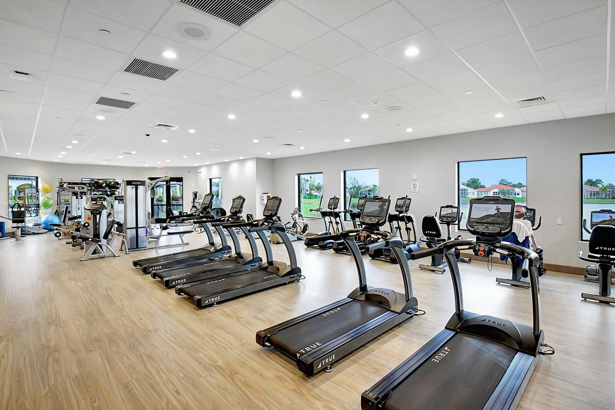 8239 Marsala Way Boynton Beach, FL 33472 - Photo 67 of 68 a view of a room with gym equipment and a table