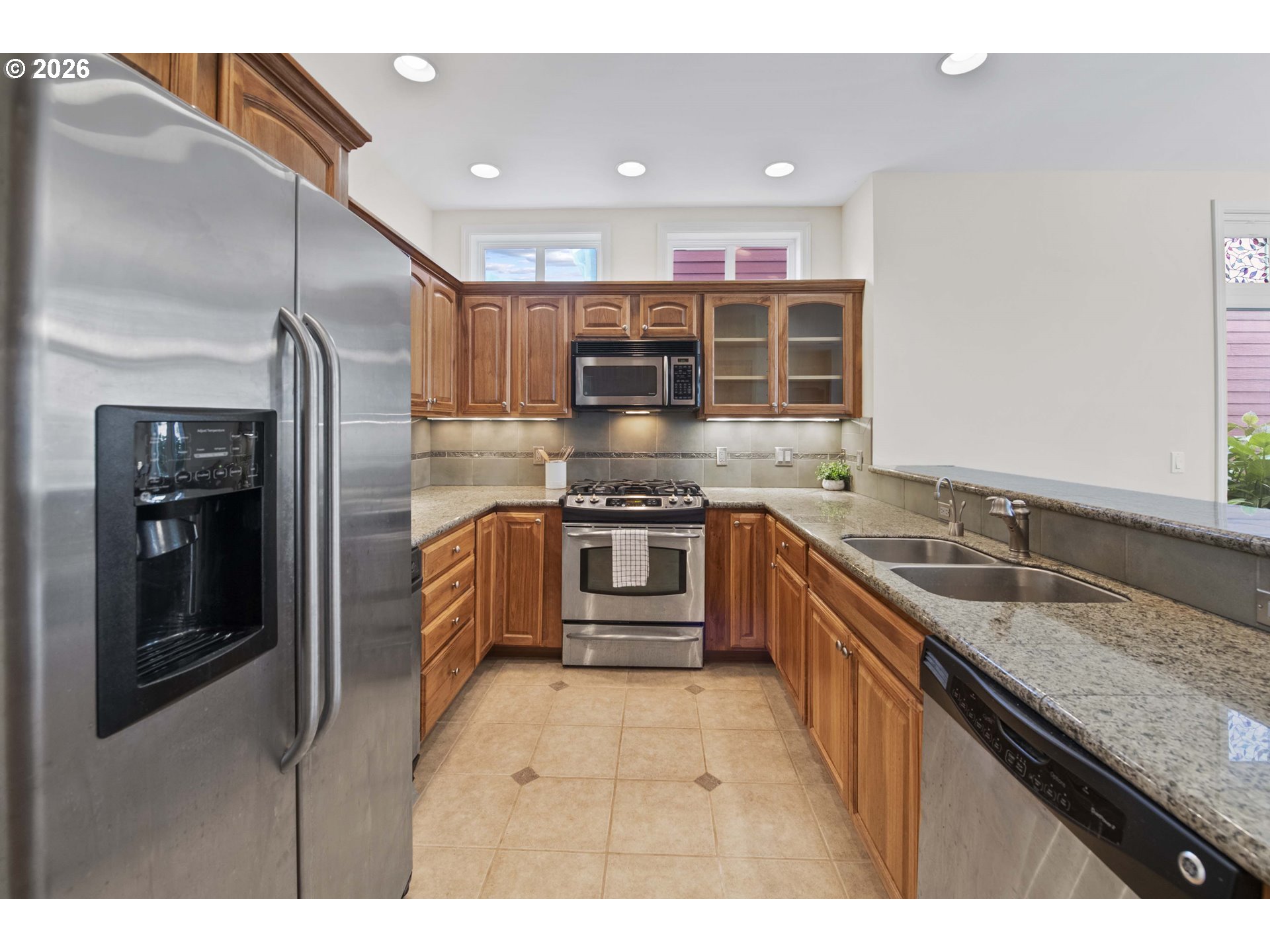 230 Round House Road Astoria, OR 97103 - Photo 14 of 43 a kitchen with stainless steel appliances granite countertop a stove and a sink