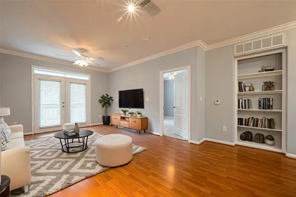 a kitchen with granite countertop wooden cabinets a refrigerator and a sink