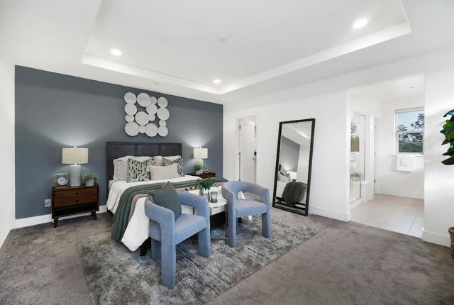 a bed room with a bed and a mirror