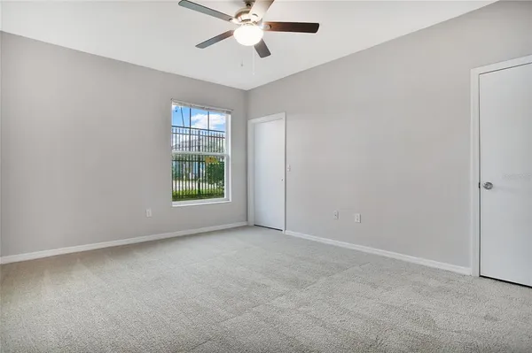 a view of an empty room with a window