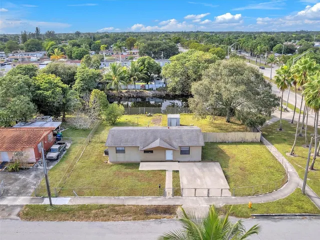 a view of a swimming pool with a yard