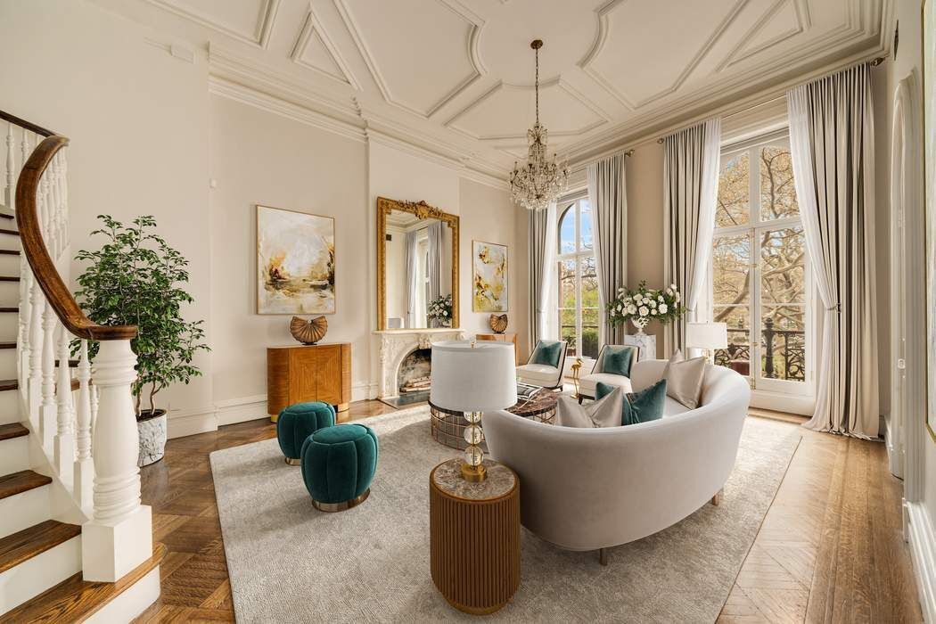 243 East 17th Street Manhattan, NY 10003 - Photo 11 of 44 a living room with furniture and a chandelier