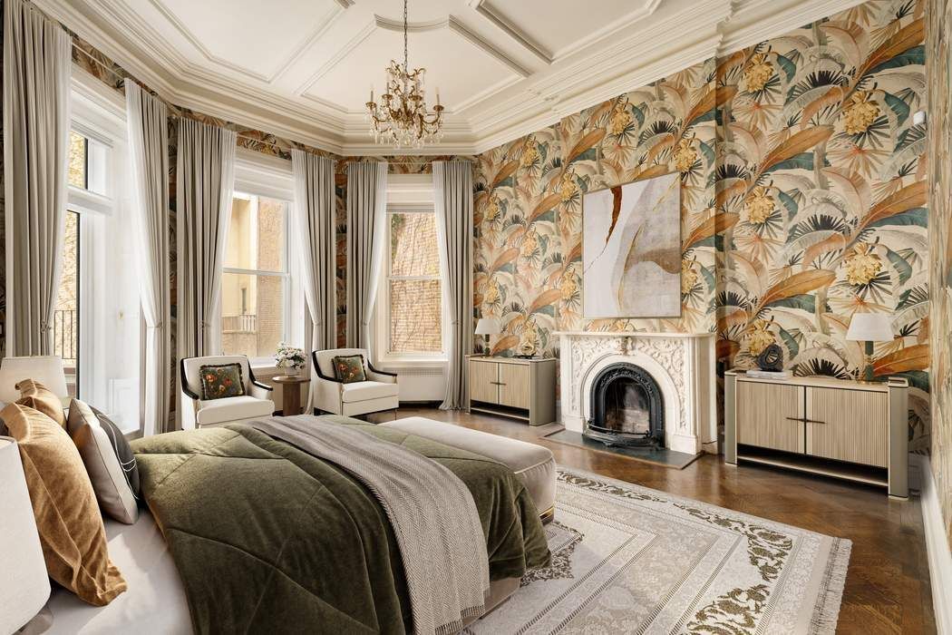 243 East 17th Street Manhattan, NY 10003 - Photo 17 of 44 a spacious bedroom with a bed and a chandelier