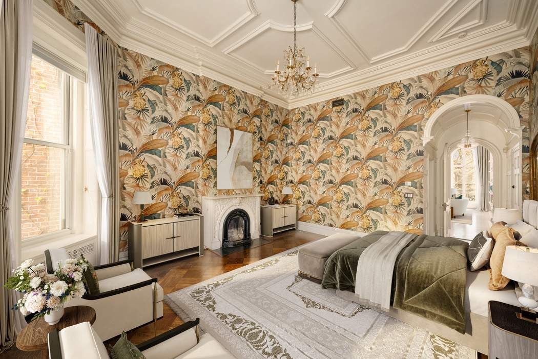 243 East 17th Street Manhattan, NY 10003 - Photo 18 of 44 a bedroom with a bed and a fireplace