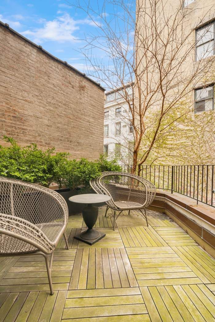 243 East 17th Street Manhattan, NY 10003 - Photo 19 of 44 a view of balcony with wooden floor and outdoor seating