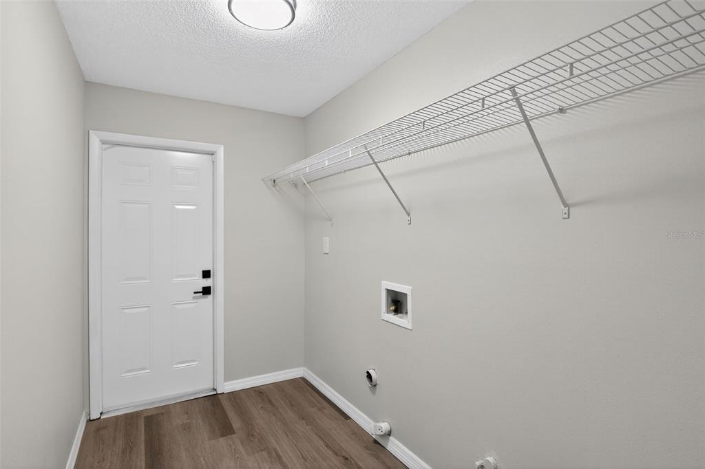 3441 Calgary Lane Mount Dora, FL 32757 - Photo 12 of 20 a view of a room with wooden floor