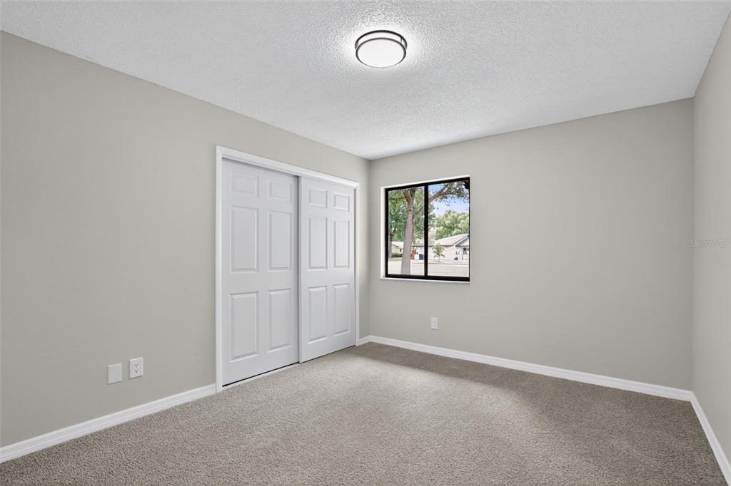 3441 Calgary Lane Mount Dora, FL 32757 - Photo 15 of 20 an empty room with windows