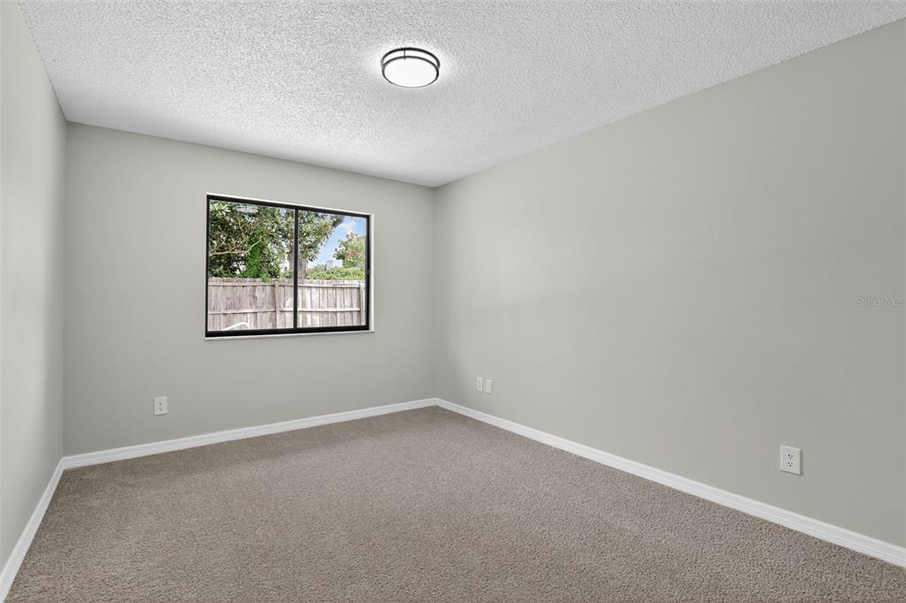 3441 Calgary Lane Mount Dora, FL 32757 - Photo 16 of 20 an empty room with windows