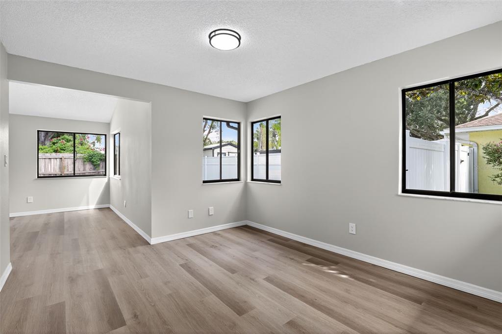 3441 Calgary Lane Mount Dora, FL 32757 - Photo 6 of 20 wooden floor in an empty room with a window