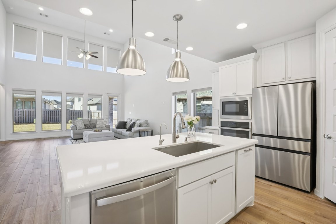 The gourmet kitchen serves as the functional centerpiece of the home.