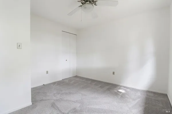 a white toilet sitting next to a bath tub