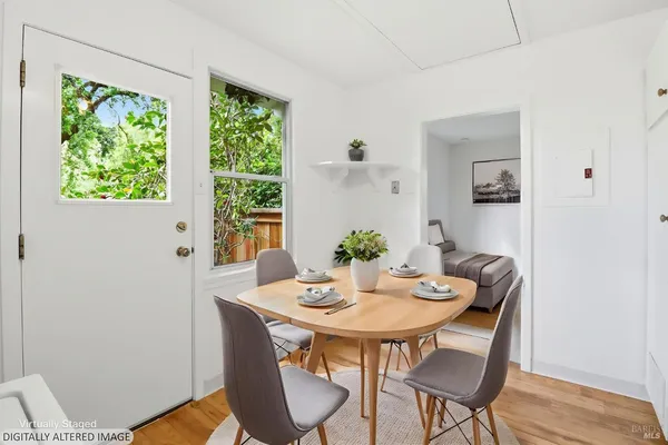 a view of a patio with table and chairs and potted plants