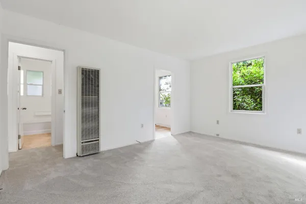 a kitchen with cabinets stainless steel appliances and a counter space