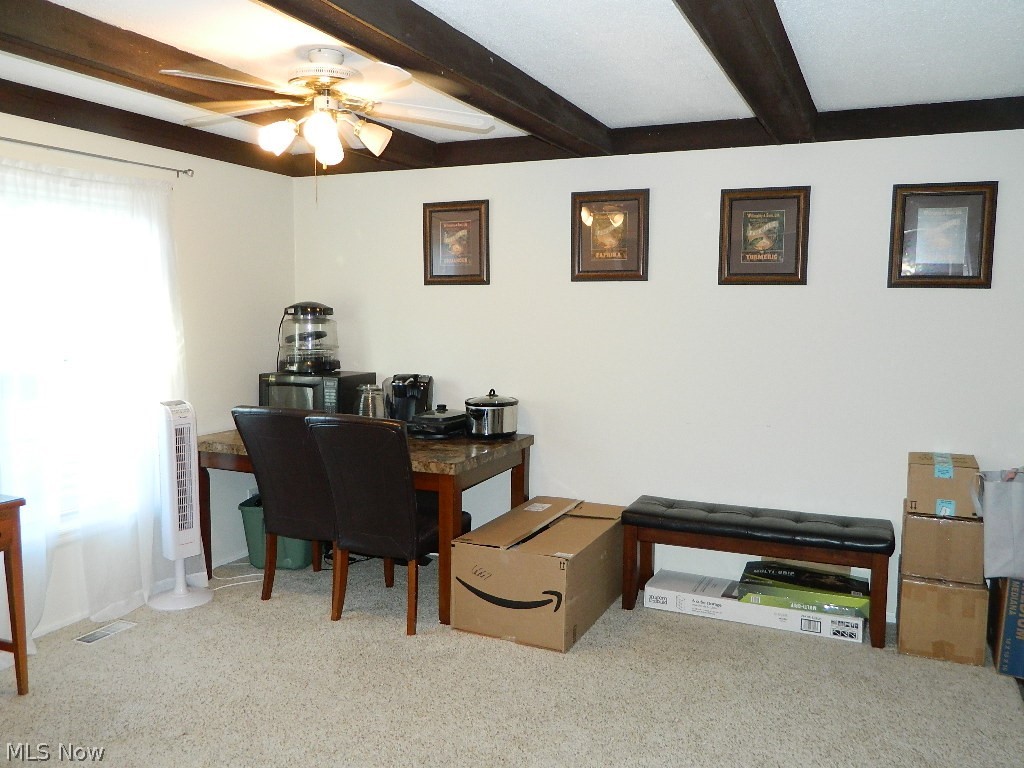 7385 Fox Mill Road, Unit 32B Mentor, OH 44060 - Photo 4 of 17 Very spacious dining room with a beamed ceiling, neutral walls and carpeting, everything in excellent condition!