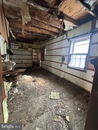 a view of room with wooden walls