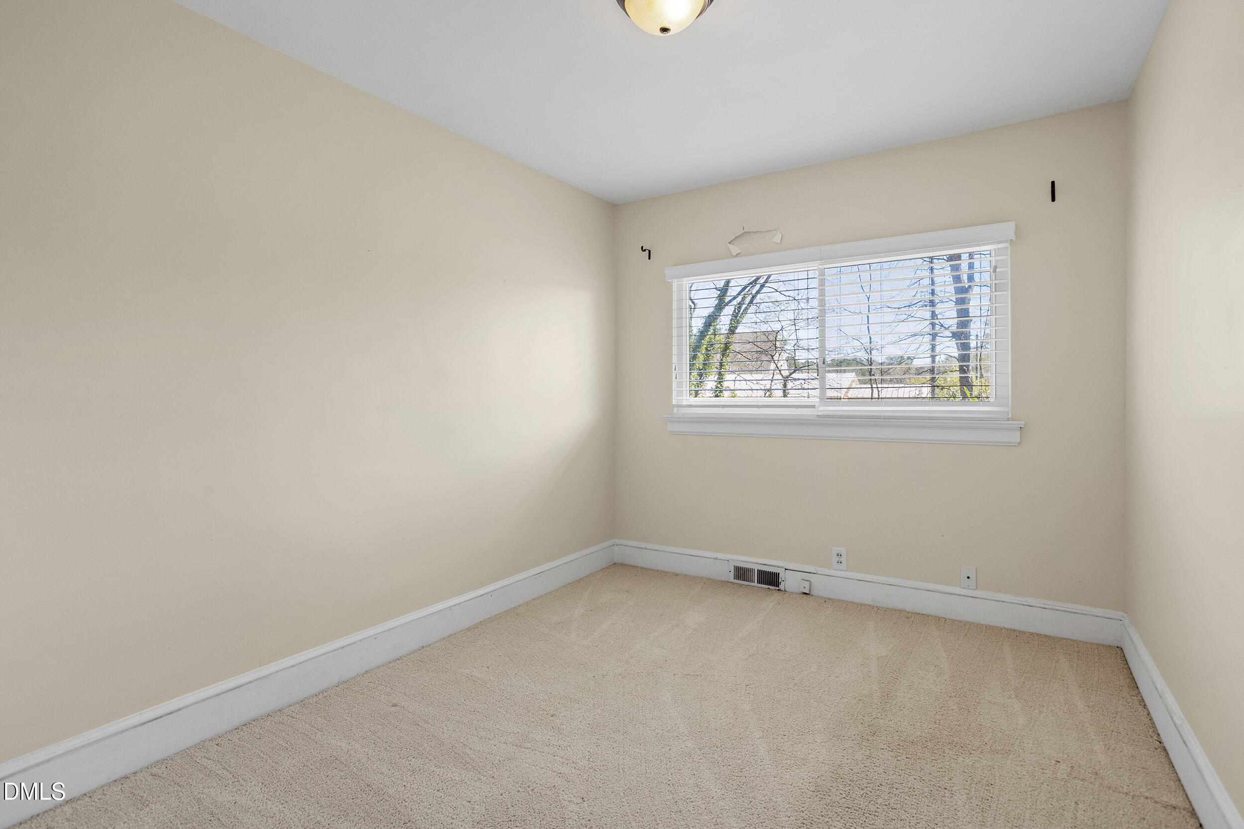 5011 Old Stage Road Raleigh, NC 27603 - Photo 22 of 29 an empty room with a window