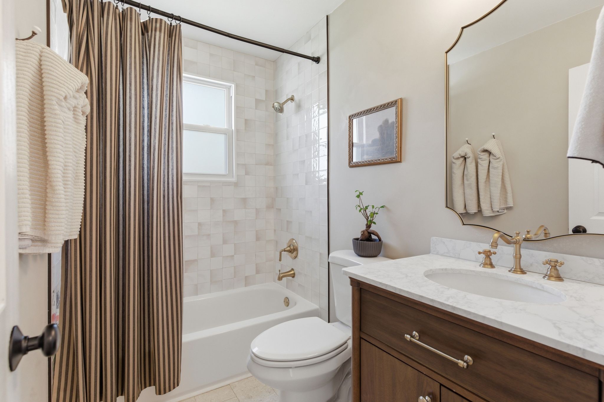 105 Regiment Court Franklin, TN 37064 - Photo 16 of 30 a bathroom with a granite countertop sink a toilet a mirror a vanity and shower