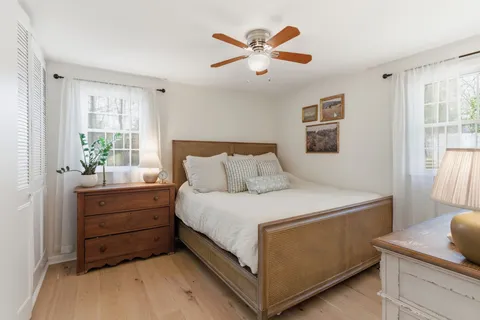 a bedroom with a bed and a table