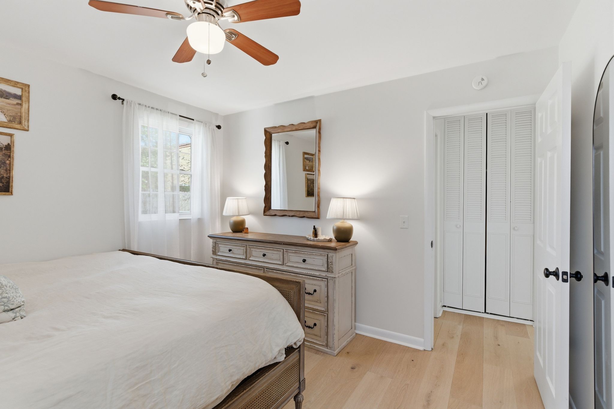 105 Regiment Court Franklin, TN 37064 - Photo 19 of 30 a bedroom with a bed and a chandelier