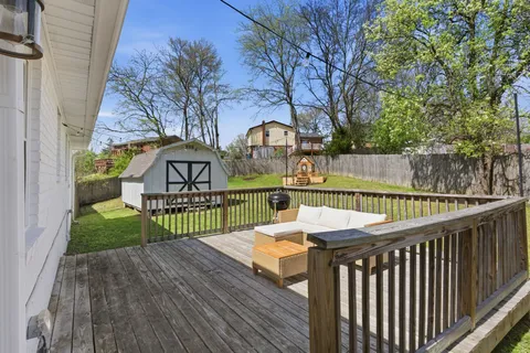 a view of a wooden deck with furniture