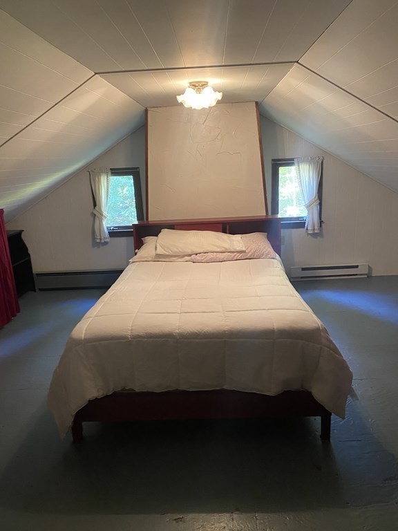 241 Sandisfield Road Sandisfield, MA 01255 - Photo 15 of 35 a bed sitting in a bedroom next to a lamp with window