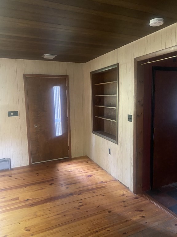 241 Sandisfield Road Sandisfield, MA 01255 - Photo 20 of 35 a view of an empty room with wooden floor and a window