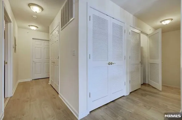 a view of a bathroom with wooden floor
