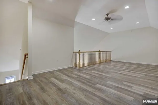 a view of a livingroom with wooden floor