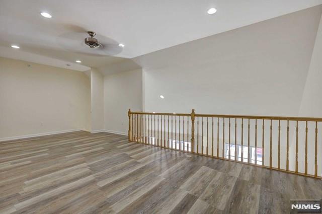 269 Main Street, Unit 2 Little Ferry, NJ 07643 - Photo 20 of 37 a view of an empty room with wooden floor