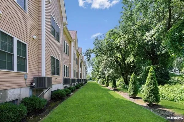 a view of a building with a yard