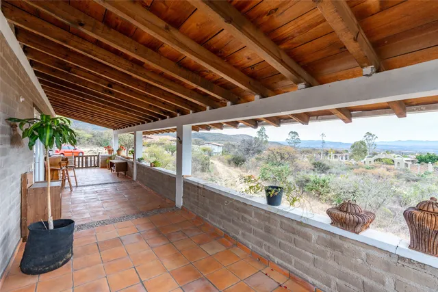 a view of a kitchen with a table and chairs