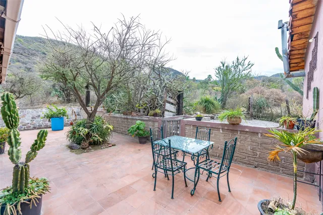 a very nice looking room with a large window and furniture