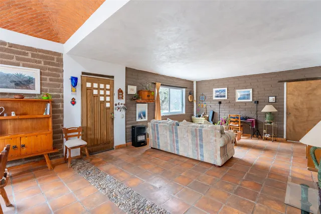 a bedroom with two beds and a couch