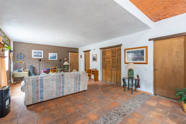 a bedroom with bed and a window