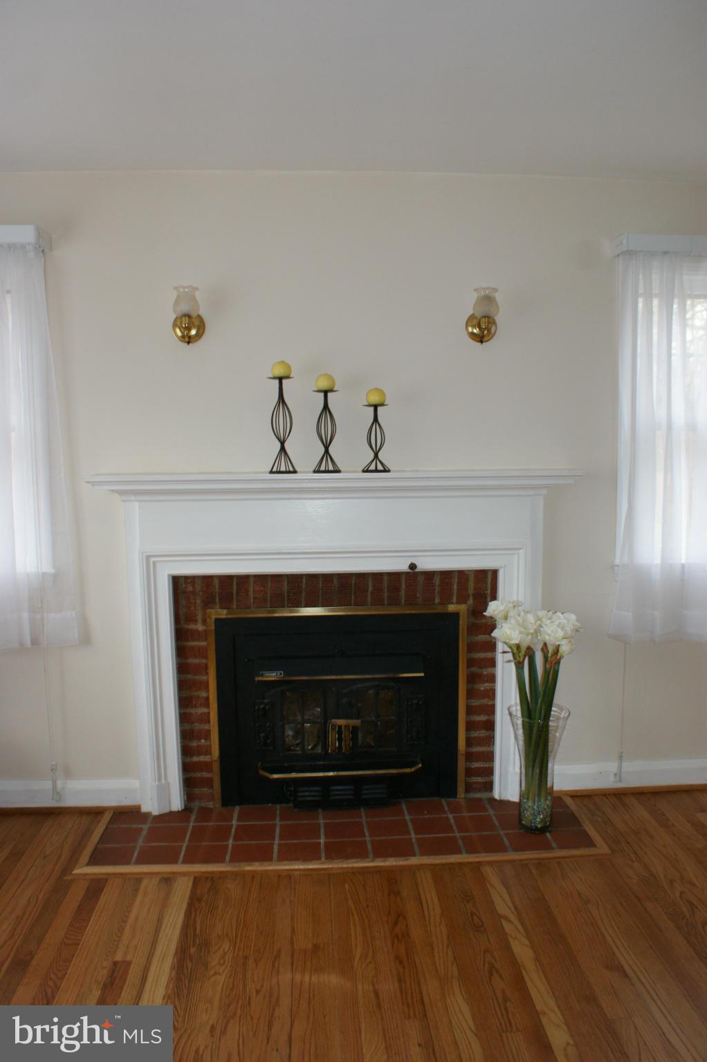 2918 Ridge Road Baltimore, MD 21244 - Photo 3 of 21 a living room with furniture and a fireplace