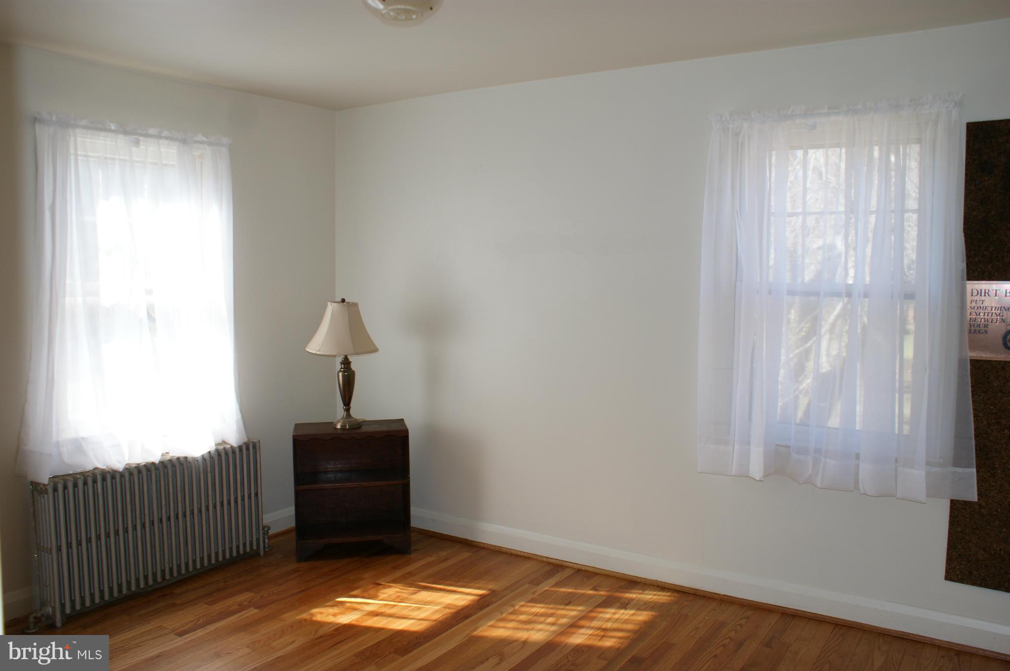 2918 Ridge Road Baltimore, MD 21244 - Photo 8 of 21 a room with window and a lamp