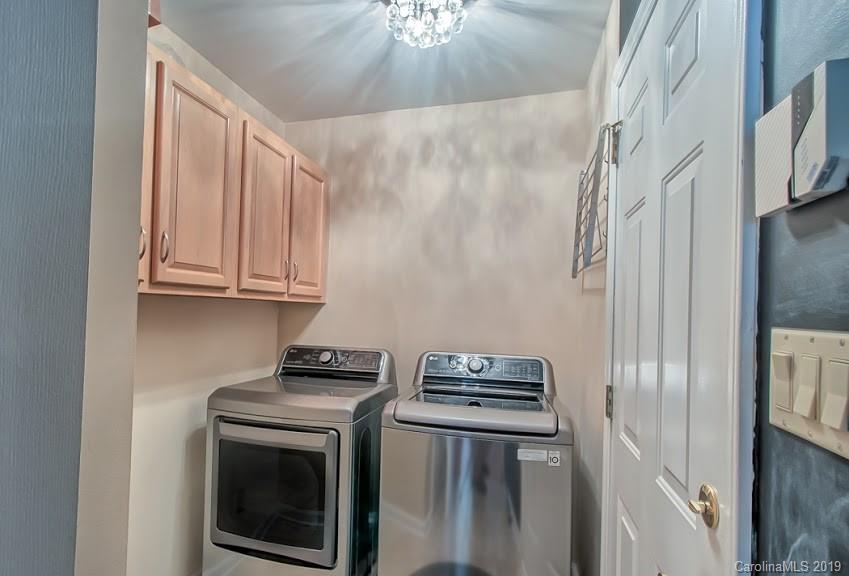 9731 Deer Spring Lane Charlotte, NC 28210 - Photo 12 of 26 a utility room with dryer and washer