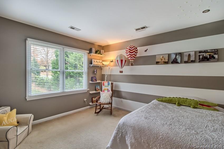 9731 Deer Spring Lane Charlotte, NC 28210 - Photo 13 of 26 a bedroom with furniture and a window