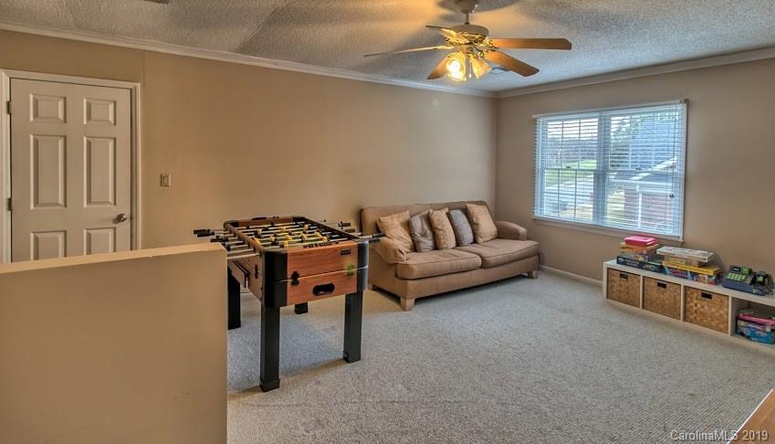 9731 Deer Spring Lane Charlotte, NC 28210 - Photo 16 of 26 a bedroom with furniture and a window