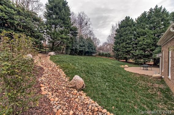 9731 Deer Spring Lane Charlotte, NC 28210 - Photo 21 of 26 a view of a tree in a garden
