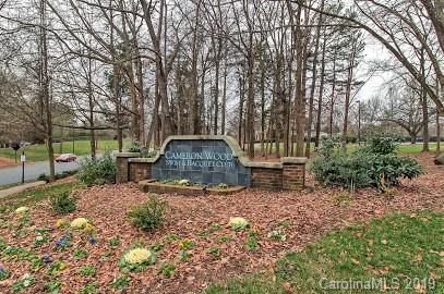 9731 Deer Spring Lane Charlotte, NC 28210 - Photo 22 of 26 a view of a bench in the garden