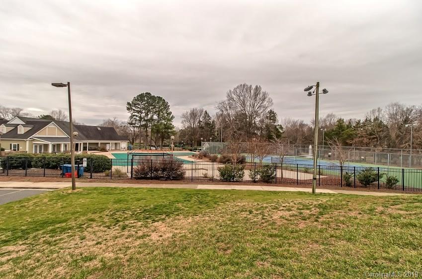9731 Deer Spring Lane Charlotte, NC 28210 - Photo 24 of 26 a view of a park with swings