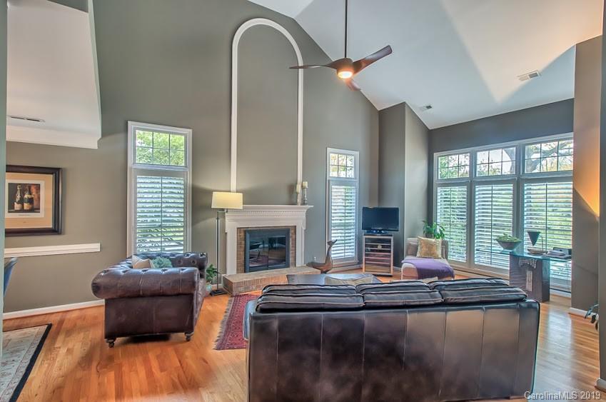 9731 Deer Spring Lane Charlotte, NC 28210 - Photo 4 of 26 a living room with furniture and a fireplace