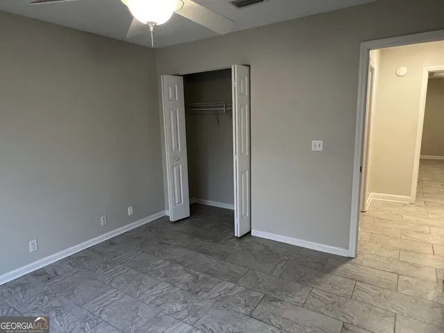an empty room with a bathroom