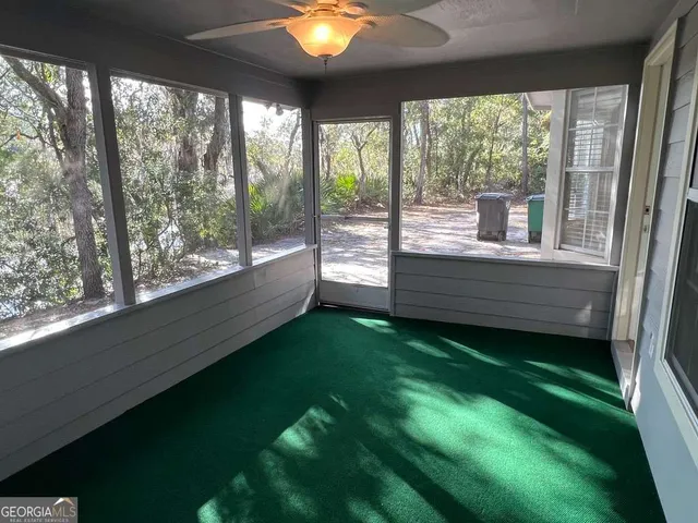 a view of a porch and garden