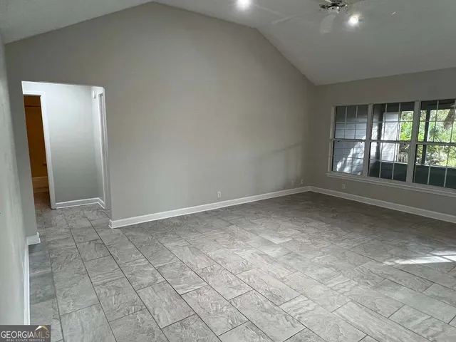 an empty room with windows