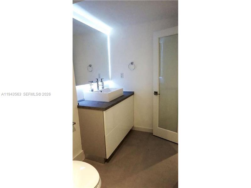 100 Lincoln Road, Unit 420 Miami Beach, FL 33139 - Photo 17 of 25 a bathroom with sink and mirror